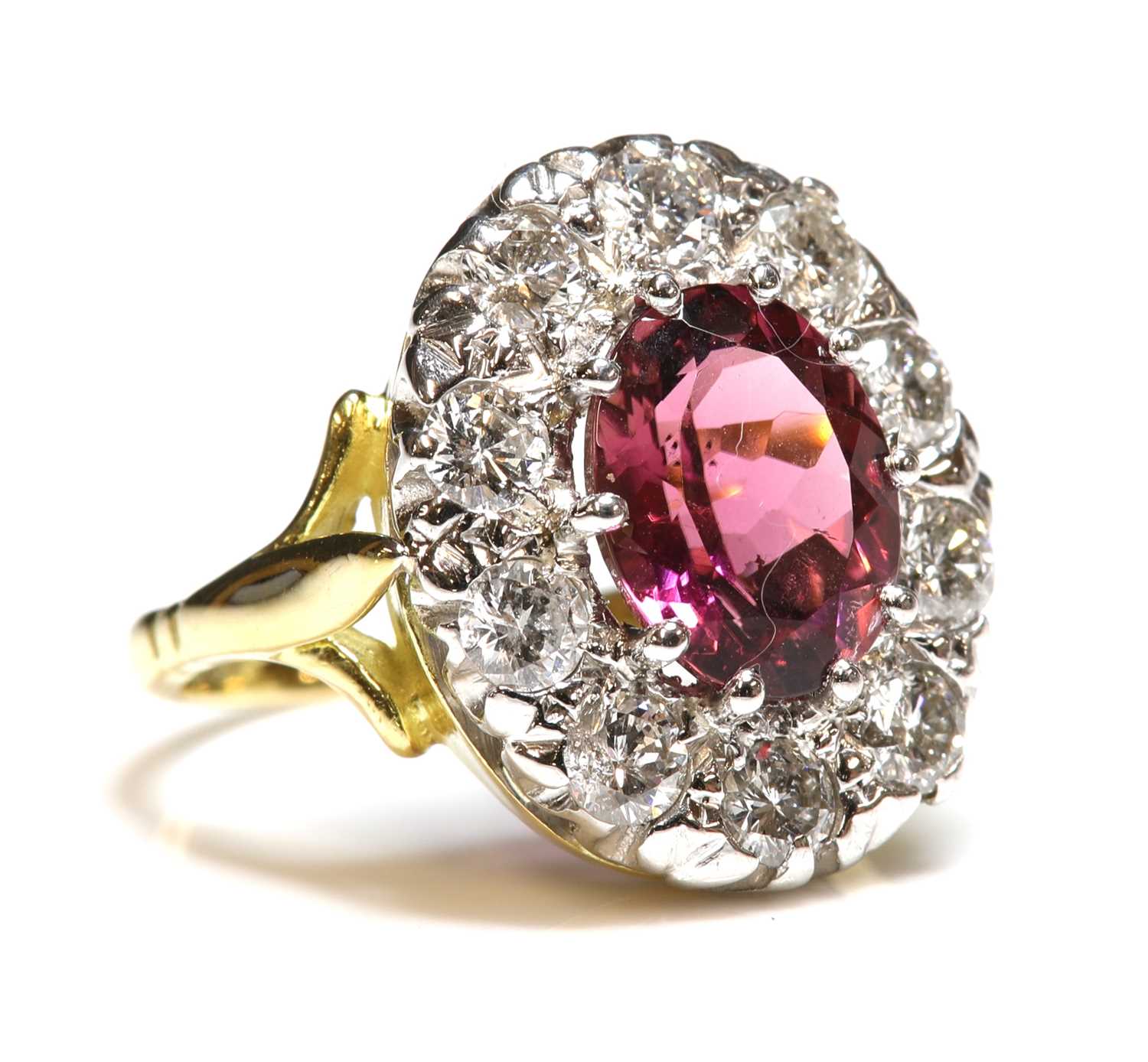 Lot 252 - An 18ct gold pink tourmaline and diamond oval cluster ring