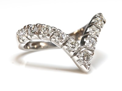 Lot 278 - A white gold diamond set half wishbone ring
