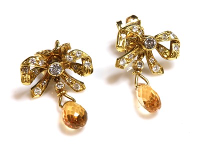 Lot 241 - A pair of 18ct gold yellow sapphire and diamond bow drop earrings, c.1990
