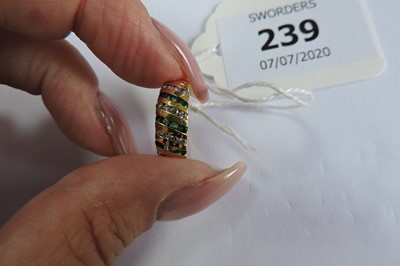 Lot 239 - An 18ct gold emerald and diamond diagonal band ring