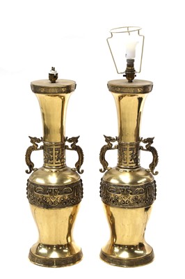 Lot 372 - A large pair of brass table lamps