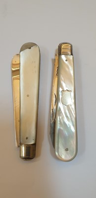 Lot 33 - Four silver and mother-of-pearl folding fruit knives