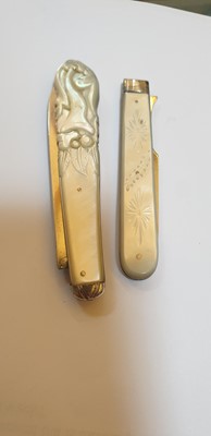 Lot 25 - Three silver and mother-of-pearl folding fruit forks and a knife