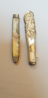 Lot 25 - Three silver and mother-of-pearl folding fruit forks and a knife