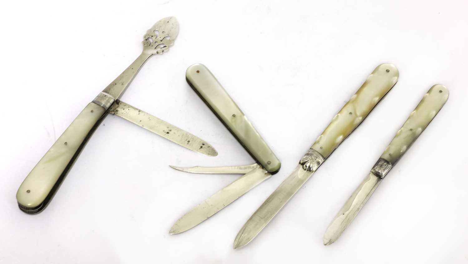 Lot 28 - Four silver and mother-of-pearl folding fruit knives