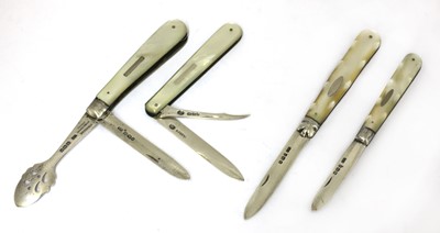 Lot 28 - Four silver and mother-of-pearl folding fruit knives