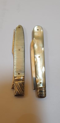 Lot 32 - Five silver and mother-of-pearl folding fruit knives and a fork