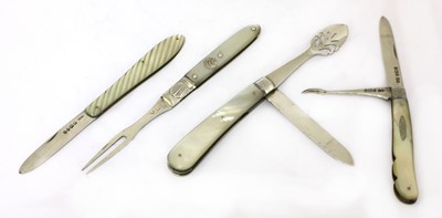 Lot 31 - Three silver and mother-of-pearl folding fruit knives and a fork