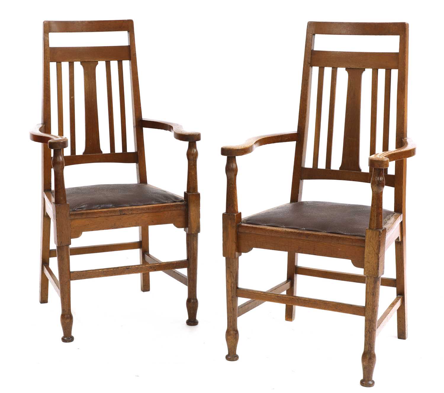 Lot 139 - A pair of Arts and Crafts oak elbow chairs