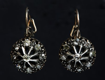 Lot 51 - A pair of Edwardian, diamond set, gold and silver cluster drop earrings, c.1910