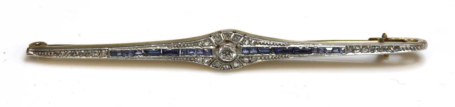 Lot 22 - An Art Deco diamond, sapphire and synthetic sapphire bar brooch, c.1925