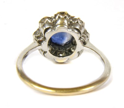 Lot 20 - A white gold sapphire and diamond circular cluster ring