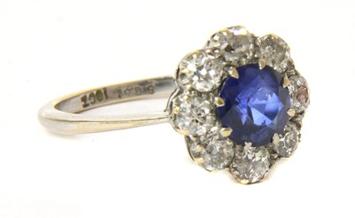 Lot 20 - A white gold sapphire and diamond circular cluster ring