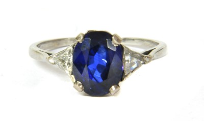 Lot 62 - A platinum sapphire and diamond three stone ring