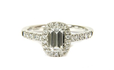Lot 65 - A platinum diamond halo cluster ring