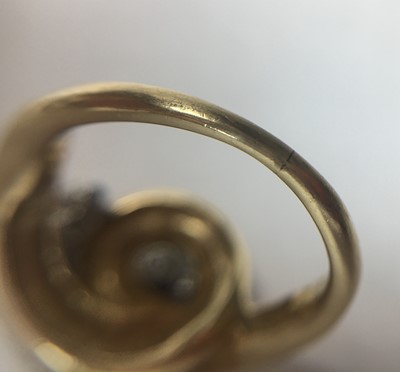 Lot 55 - A gold diamond dress ring