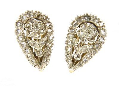 Lot 64 - A pair of silver and gold diamond clip earrings