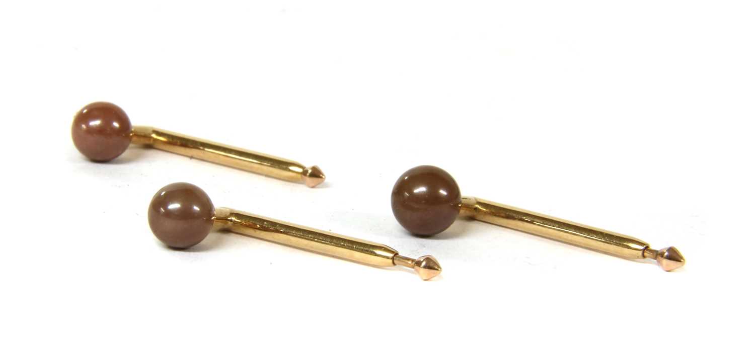 Lot 25 - A cased set of three brown pearl dress studs