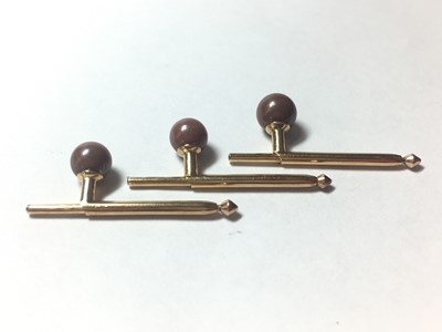 Lot 25 - A cased set of three brown pearl dress studs