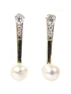 Lot 30 - A pair of white gold pearl and diamond drop earrings