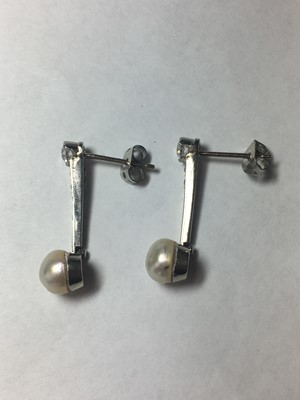 Lot 30 - A pair of white gold pearl and diamond drop earrings