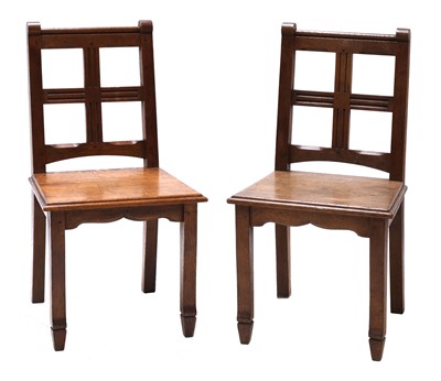 Lot 637 - A pair of oak hall chairs