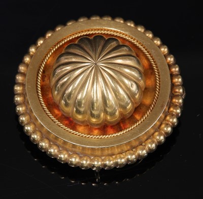Lot 46 - A Victorian Etruscan Revival gold shield form brooch, c.1870
