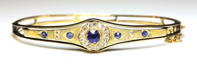 Lot 52 - An Edwardian gold sapphire and diamond bangle, c.1900