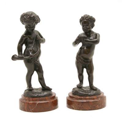 Lot 128 - A pair of bronze musicians