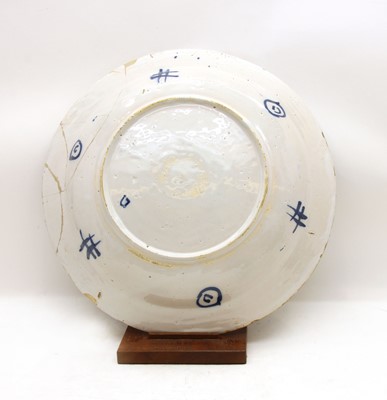 Lot 109 - A 19th century blue and white tin glazed charger
