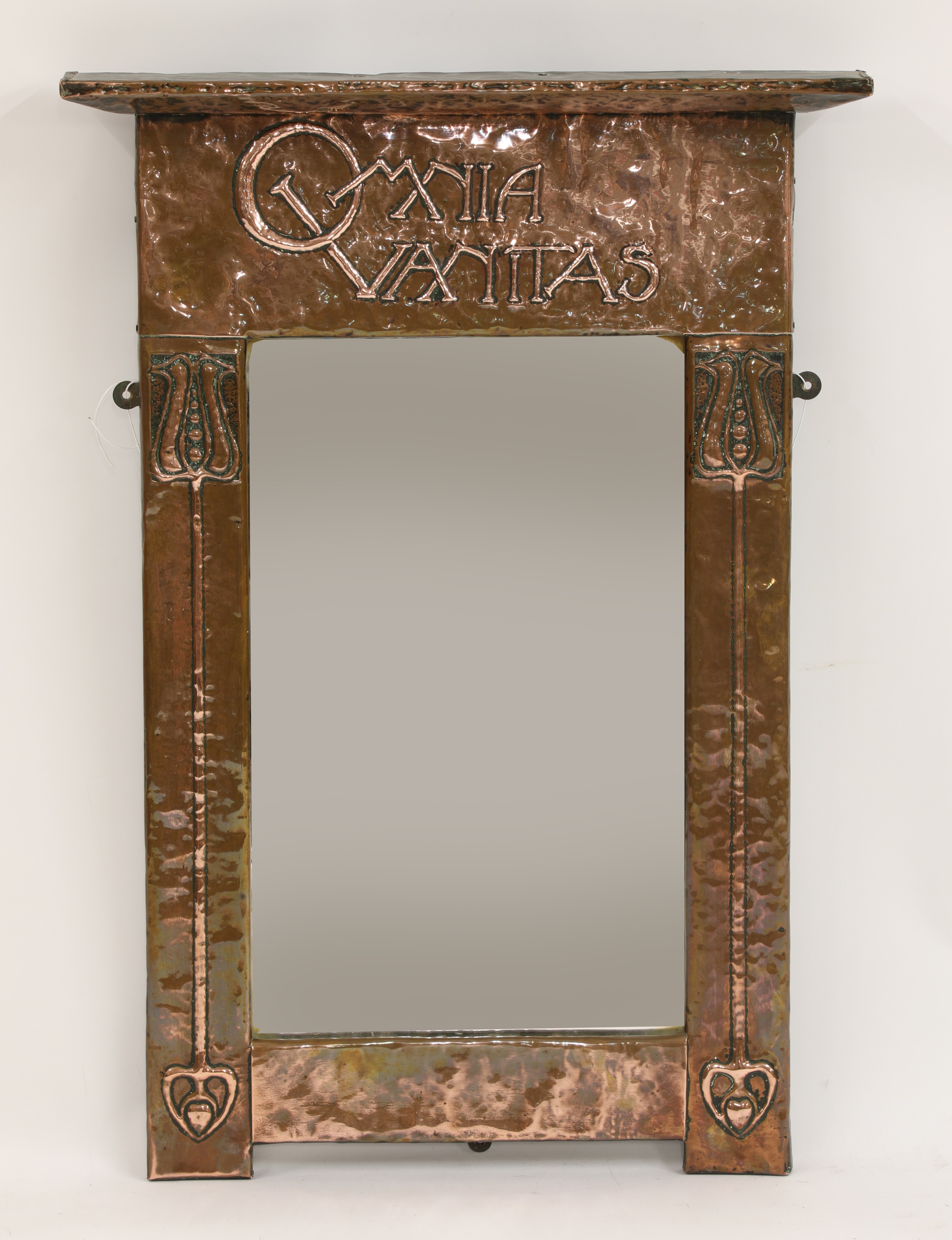 Lot 141 An Arts and Crafts copper wall mirror,