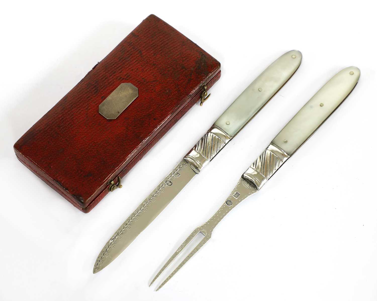 Lot 21 - A mother-of-pearl and silver folding fruit knife and fork set