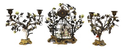 Lot 252 - A Northern European porcelain-mounted clock garniture