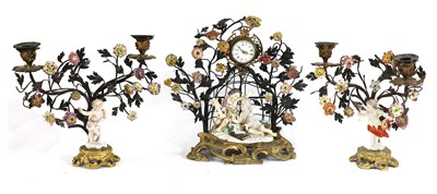 Lot 252 - A Northern European porcelain-mounted clock garniture