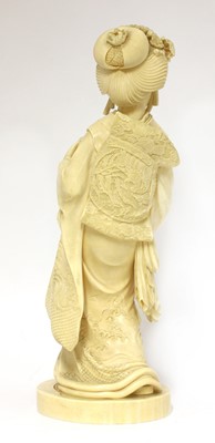 Lot 221 - A Japanese Meiji period ivory okimono