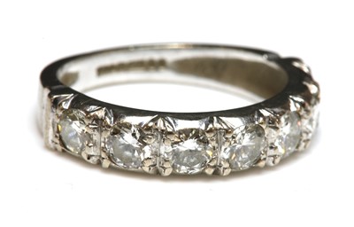 Lot 284 - An 18ct white gold diamond set half eternity ring
