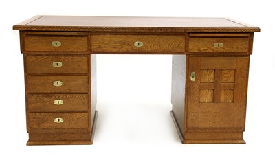 Lot 154 - An oak pedestal desk