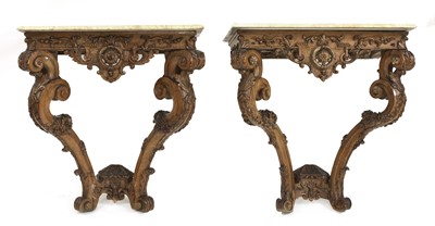Lot 613 - A pair of Continental pine console tables