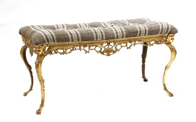 Lot 637 - A gilt brass and button upholstered stool