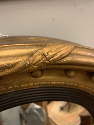 Lot 540 - A Regency gilt convex mirror