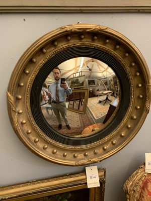 Lot 540 - A Regency gilt convex mirror