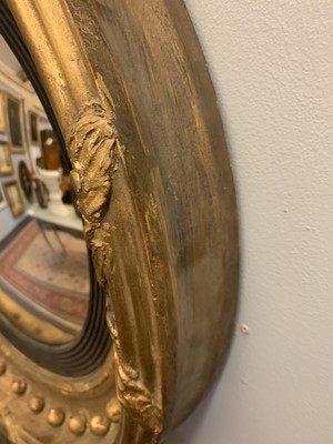 Lot 540 - A Regency gilt convex mirror