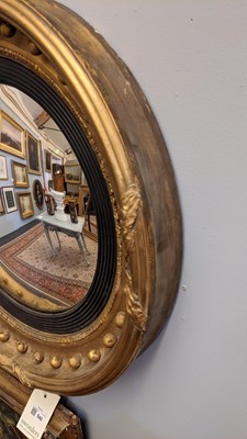 Lot 540 - A Regency gilt convex mirror