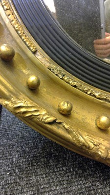 Lot 540 - A Regency gilt convex mirror