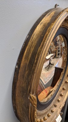 Lot 540 - A Regency gilt convex mirror