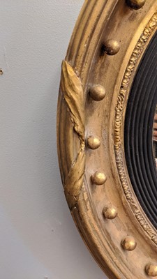 Lot 540 - A Regency gilt convex mirror