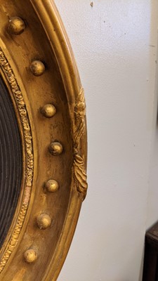 Lot 540 - A Regency gilt convex mirror