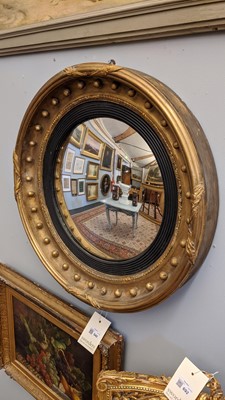 Lot 540 - A Regency gilt convex mirror