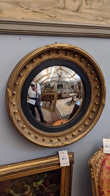 Lot 540 - A Regency gilt convex mirror