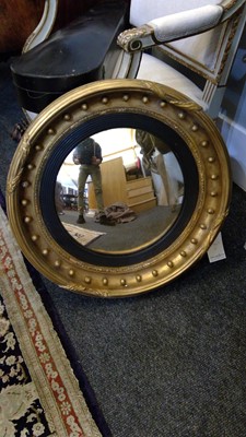 Lot 540 - A Regency gilt convex mirror
